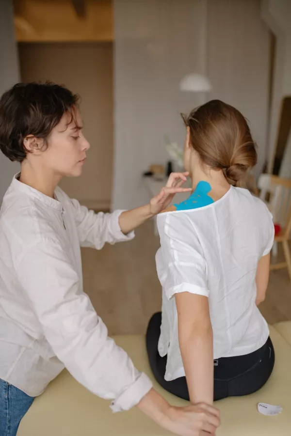 female chiropactor working on womans neck